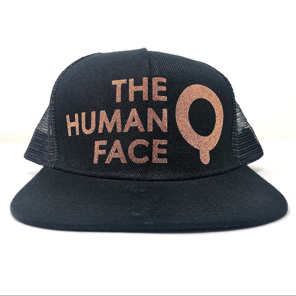 “The HUMAN Face” trucker hat by HUMAN